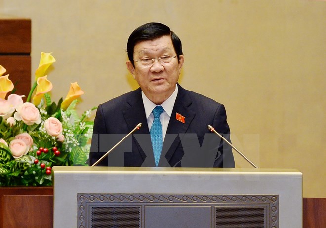 Chủ tịch nước Trương Tấn Sang báo cáo về đề nghị Quốc hội phê chuẩn Nghị định thư sửa đổi Hiệp định thành lập Tổ chức Thương mại Thế giới (WTO). (Ảnh: Doãn Tấn/TTXVN)