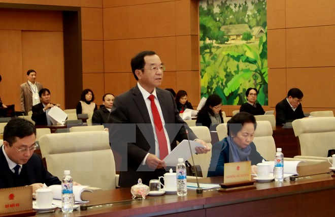 Chủ nhiệm Văn phòng Chủ tịch nước Đào Việt Trung đọc dự thảo Báo cáo công tác. (Ảnh: Phương Hoa/TTXVN)