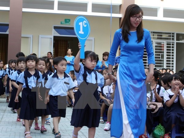  Học sinh khai giảng năm học mới. (Ảnh: TTXVN)