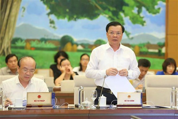 Thong nhat y kien Uy ban Chung khoan Nha nuoc truc thuoc Bo Tai chinh hinh anh 2Bộ trưởng Bộ Tài chính Đinh Tiến Dũng phát biểu ý kiến. (Ảnh: Doãn Tấn/TTXVN)
