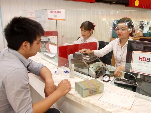 Ngân hàng dành nguồn vốn dồi dào hỗ trợ kinh doanh cuối năm. (Ảnh: CTV/Vietnam+)