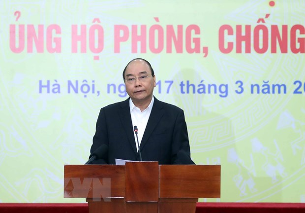 Thủ tướng Nguyễn Xuân Phúc phát biểu tại Lễ phát động toàn dân ủng hộ phòng, chống dịch COVID-19. (Ảnh: Thống Nhất/TTXVN)