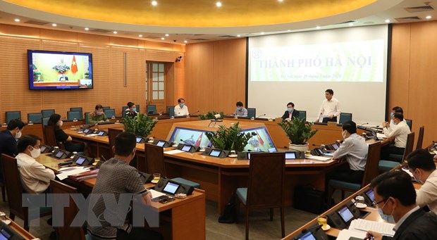 Chủ tịch Ủy ban Nhân dân thành phố Hà Nội Nguyễn Đức Chung phát biểu tại điểm cầu thành phố Hà Nội. (Ảnh: Văn Điệp/TTXVN)