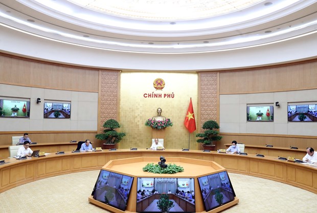  Thủ tướng Nguyễn Xuân Phúc chủ trì buổi làm việc Thường trực Chính phủ với Ban Chỉ đạo Quốc gia phòng, chống dịch COVID-19. (Ảnh: Thống Nhất/TTXVN)