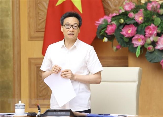 Phó Thủ tướng Vũ Đức Đam chủ trì buổi làm việc. (Ảnh: Văn Điệp/TTXVN)