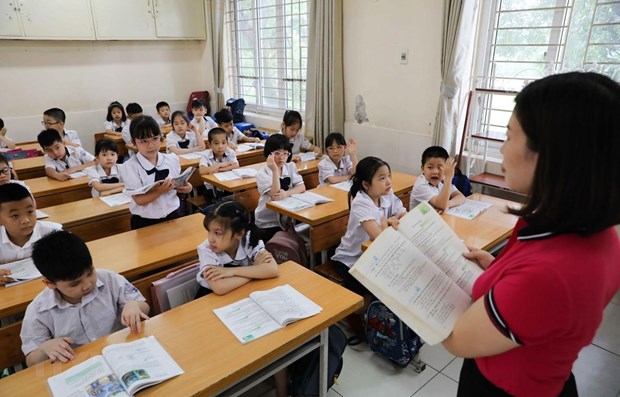 Sách giáo khoa mới sẽ được triển khai trong các nhà trường từ năm học 2020-2021, bắt đầu với lớp 1. (Ảnh: TTXVN)