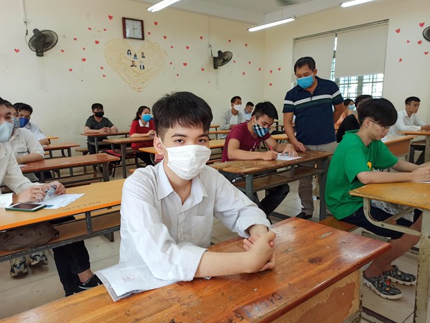  Thí sinh dự thi Tốt nghiệp Trung học phổ thông. Điểm kỳ thi này sẽ vẫn là phương thức chủ yếu, được các trường đại học dành phần lớn chỉ tiêu để xét tuyển trong năm 2021. (Ảnh: Phạm Mai/Vietnam+)