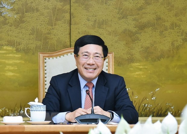 Phó Thủ tướng, Bộ trưởng Bộ Ngoại giao Phạm Bình Minh tại buổi điện đàm với Đặc phái viên Tổng thống Hoa Kỳ về biến đổi khí hậu John Kerry. (Ảnh: TTXVN)