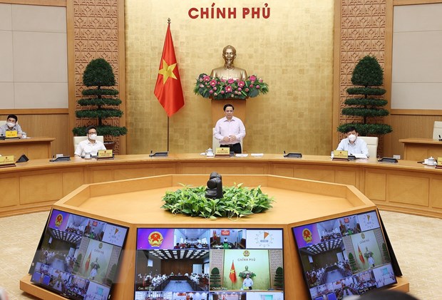 Thủ tướng Phạm Minh Chính chủ trì cuộc họp trực tuyến với lãnh đạo tỉnh. (Ảnh: Dương Giang/TTXVN)