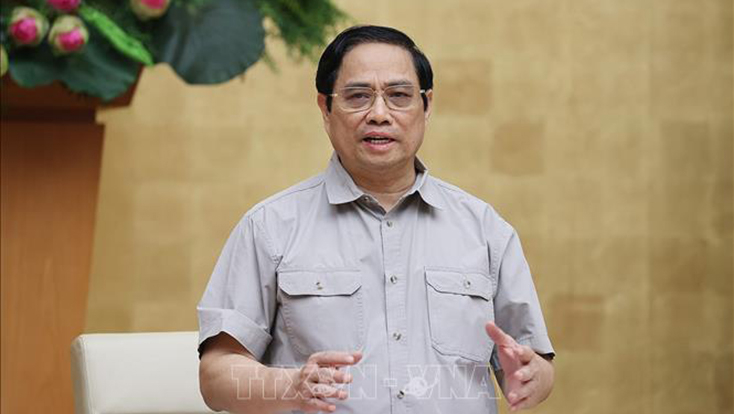 Thủ tướng Phạm Minh Chính, Trưởng ban Chỉ đạo Quốc gia phòng, chống dịch COVID-19 chủ trì cuộc họp. Ảnh: Dương Giang/TTXVN.