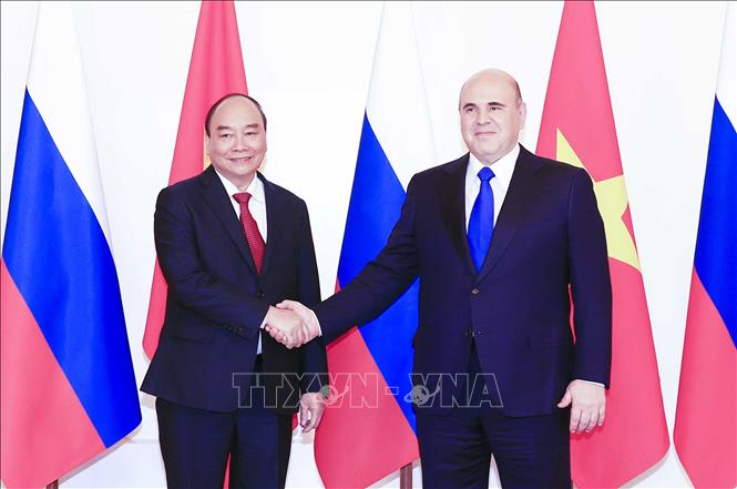 Chủ tịch nước Nguyễn Xuân Phúc hội kiến Thủ tướng Liên bang Nga Mikhail Vladimirovich Mishustin. Ảnh: Thống Nhất/TTXVN
