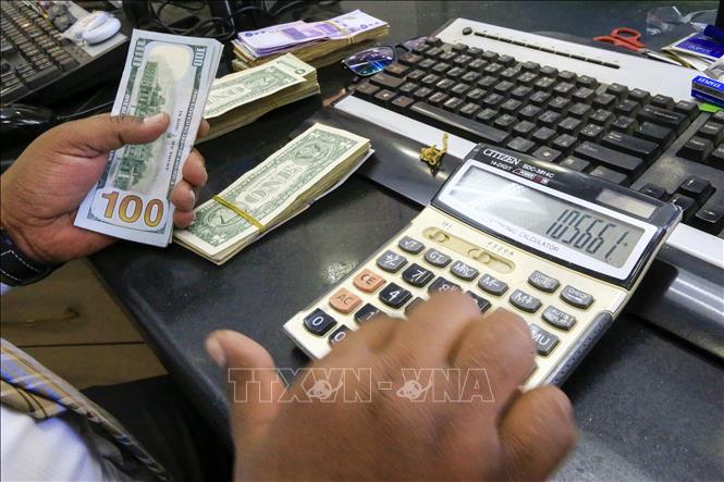  Tỷ giá trung tâm sáng 7-12-2021 ở mức 23.210 VND/USD, tăng mạnh tới 50 đồng so với hôm qua. Ảnh minh họa: TTXVN