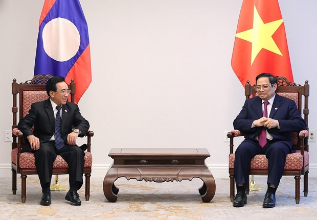 Thủ tướng Chính phủ Phạm Minh Chính tiếp Thủ tướng Lào Phankham Viphavanh. (Ảnh: Dương Giang/TTXVN)