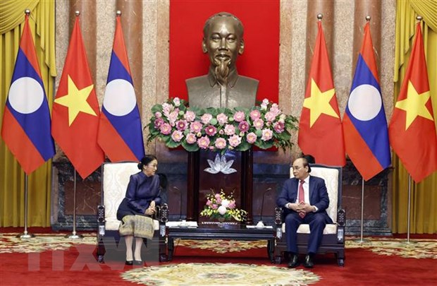 Chủ tịch nước Nguyễn Xuân Phúc tiếp Phó Chủ tịch nước CHDCND Lào Pany Yathotou ngày 26/4/2022 tại Hà Nội. (Ảnh: Thống Nhất/TTXVN)