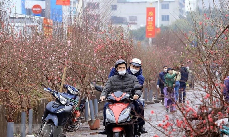 Chính phủ đã quyết định phương án nghỉ Tết Quý Mão năm 2023. (Ảnh minh hoạ: Tuấn Anh/TTXVN)
