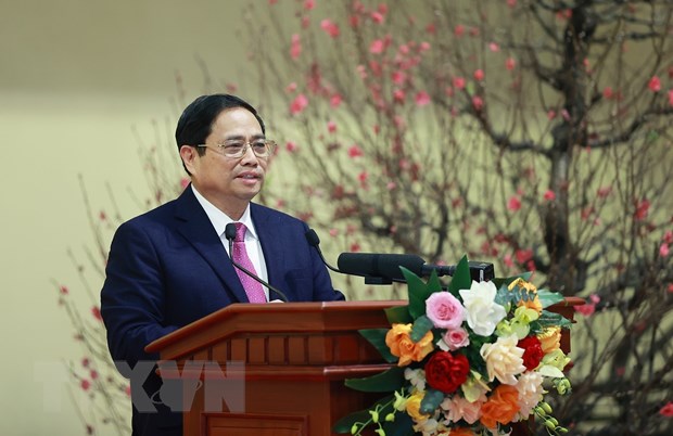 Thủ tướng Phạm Minh Chính chúc Tết ngành ngân hàng. (Ảnh: Dương Giang/TTXVN)