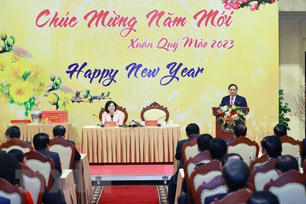 Thủ tướng Phạm Minh Chính chúc Tết ngành ngân hàng. (Ảnh: Dương Giang/TTXVN)