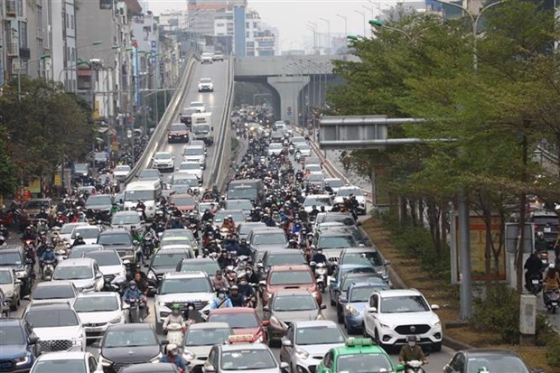 Hướng đi từ Trường Chinh ra Ngã Tư Sở trở lại ùn tắc ngày mùng 6 Tết. (Ảnh: Huy Hùng/TTXVN)