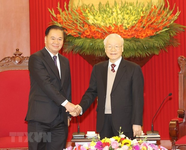 Tổng Bí thư Nguyễn Phú Trọng tiếp Chánh Văn phòng Trung ương Đảng Nhân dân Cách mạng Lào Thongsalith Mangnomek. (Ảnh: Trí Dũng/TTXVN)