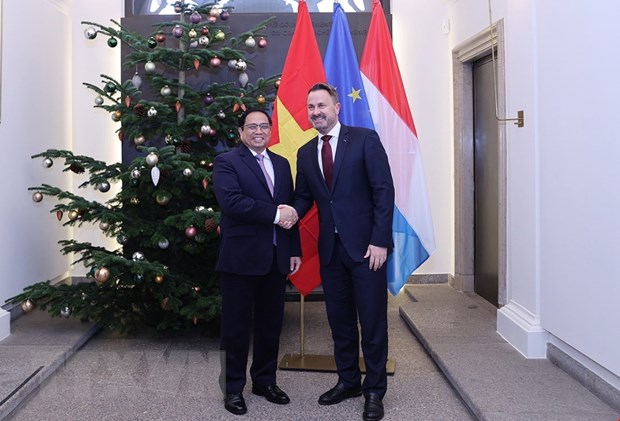 Thủ tướng Chính phủ Phạm Minh Chính và Thủ tướng Luxembourg Xavier Bettel. (Ảnh: Dương Giang/TTXVN)
