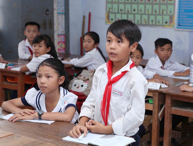Chương trình giáo dục phổ thông mới đang được triển khai ở cả ba cấp học. (Ảnh: PV/TTXVN)