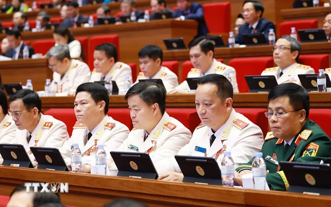 Đoàn đại biểu Đảng bộ Công an Trung ương dự phiên thảo luận tại hội trường về các văn kiện Đại hội, chiều 21/1. (Ảnh: TTXVN)