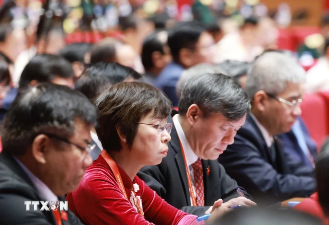 Các đại biểu dự phiên thảo luận tại hội trường về các văn kiện Đại hội, sáng 21/1. (Ảnh: TTXVN)