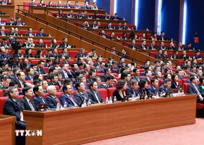 Các đại biểu dự phiên thảo luận tại hội trường về các văn kiện Đại hội, sáng 21/1. (Ảnh: TTXVN)