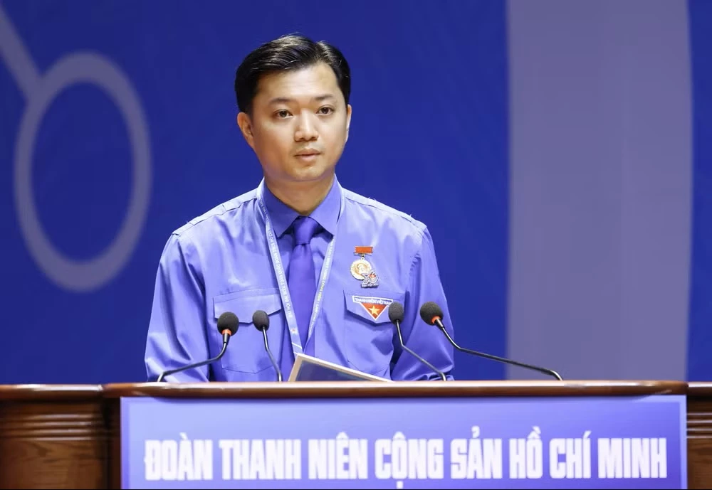 Bí thư Trung ương Đoàn Nguyễn Minh Triết trình bày tờ trình Báo cáo chính trị. (Ảnh: Vietnam+)