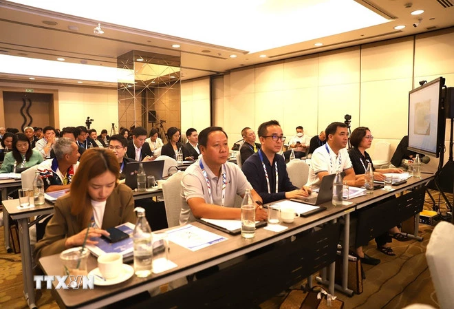 Nhà báo, phóng viên thể thao từ Việt Nam sang tham dự hội nghị. (Ảnh: Đỗ Sinh/TTXVN)