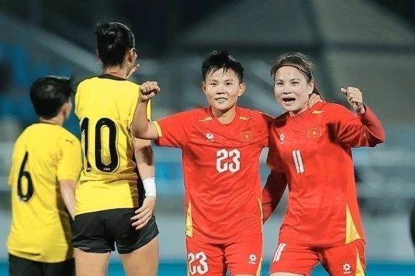 Thái Thị Thảo (số 11) vào sân và ghi 3 bàn thắng. (Ảnh: TTXVN)